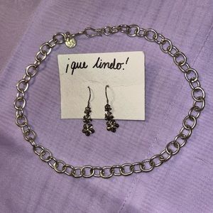 Silver chain choker and silver mini dangle earrings.